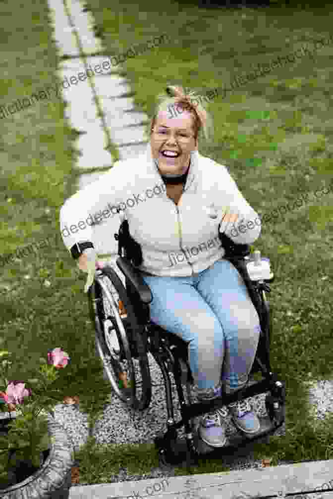 Donna Andrews, A Woman In A Wheelchair, Smiling And Looking At The Camera MY HERO Donna Andrews