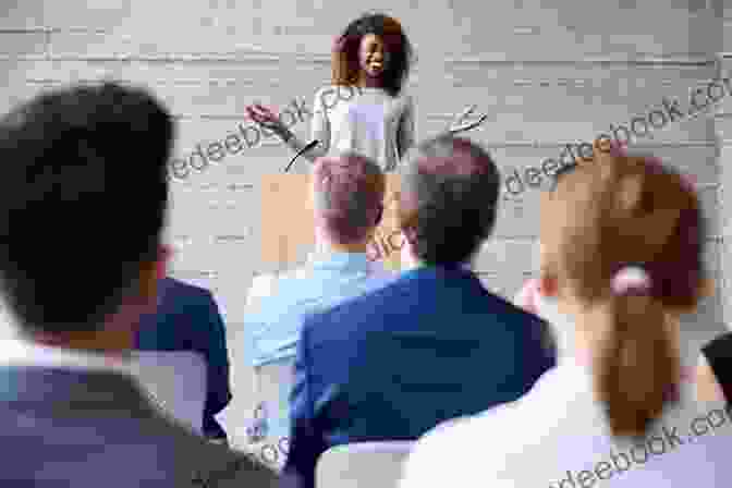Nikki Meyer Speaking At An Event, Surrounded By Audience Members Game For Anything Nikki Meyer